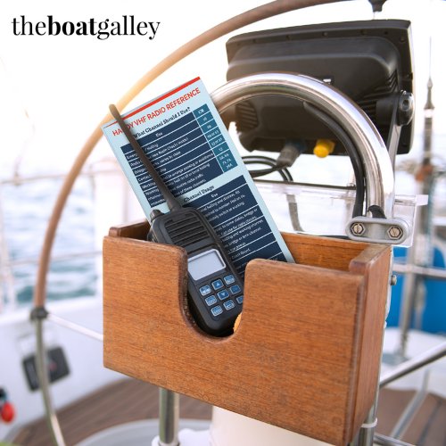 Handy VHF Reference at the helm, next to a handheld VHF radio