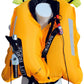 The Cruising Solutions TeamO PFD with BackTow™ – Offshore Blue Hammar is shown on a mannequin, featuring black buckled straps, reflective strips, CO2 canister, safety whistle, harness, and a folded neon green hood at the top.