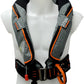 A torso mannequin displays the Cruising Solutions TeamO PFD with BackTow™ - Ocean Grey ProSensor Elite, an inflatable harness with orange trim, labeled 275N. It features buckles, straps, a pull cord, and advanced BackTow™ marine safety technology.