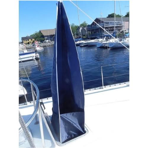 Navy blue Breeze Bandit 4-way wind scoop rigged over a sailboat hatch at a marina