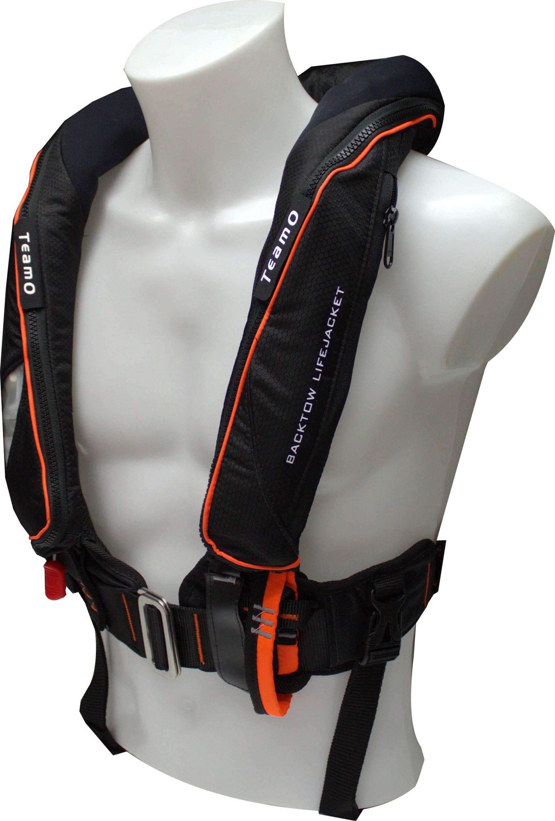 A black and orange TeamO PFD with BackTow™ - Offshore Black ProSensor Elite by Cruising Solutions is displayed on a white mannequin torso, featuring adjustable straps, visible buckles, and advanced BackTow Technology.