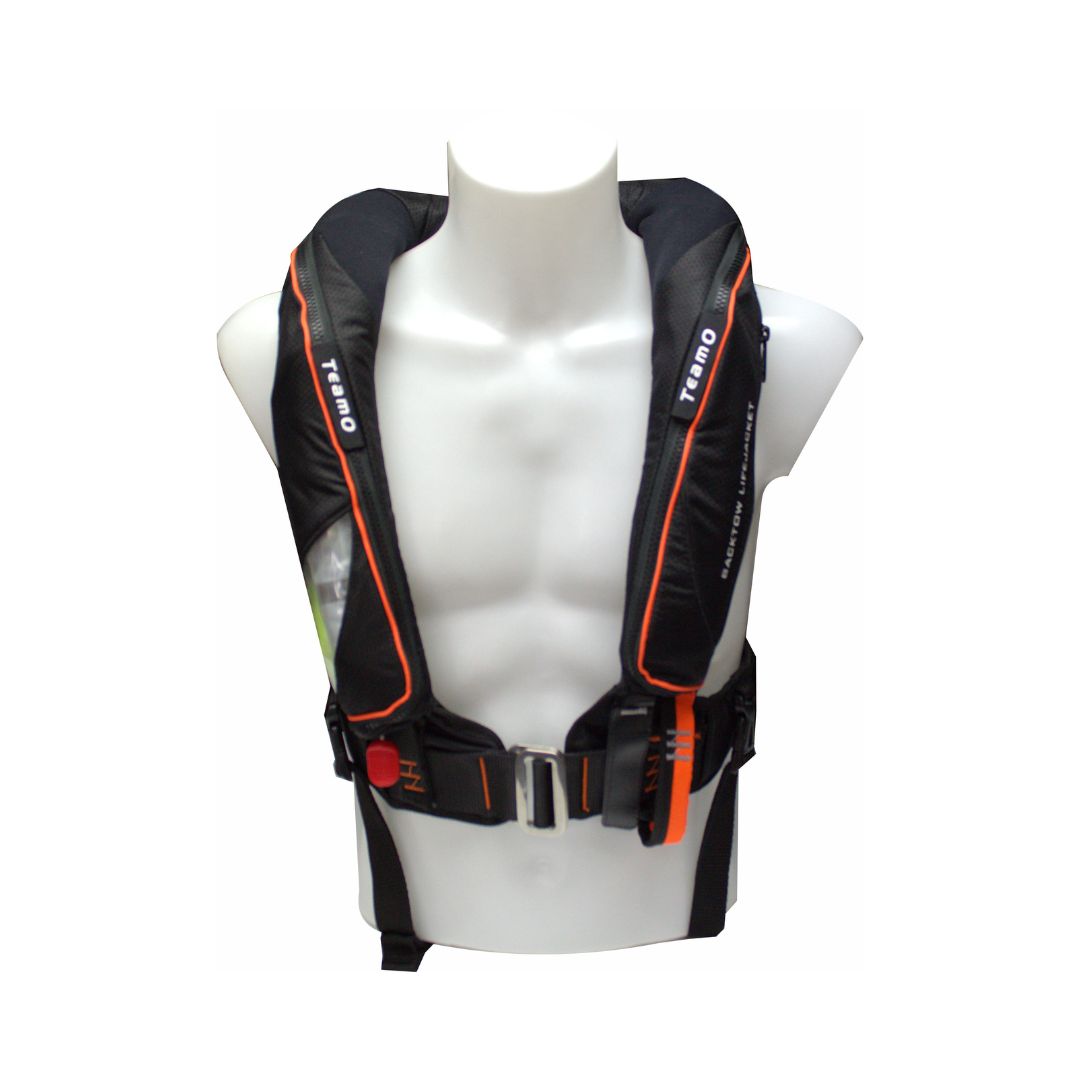 A Cruising Solutions TeamO PFD with BackTow™ - Offshore Black Hammar, featuring adjustable straps and buckles in black and orange, is displayed on a white mannequin torso against a plain white background.