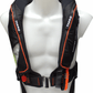 The Cruising Solutions TeamO PFD with BackTow™ - Offshore Black ProSensor Elite, in black and orange, is shown on a white mannequin torso with adjustable straps, front buckle, and BackTow Technology for offshore safety.